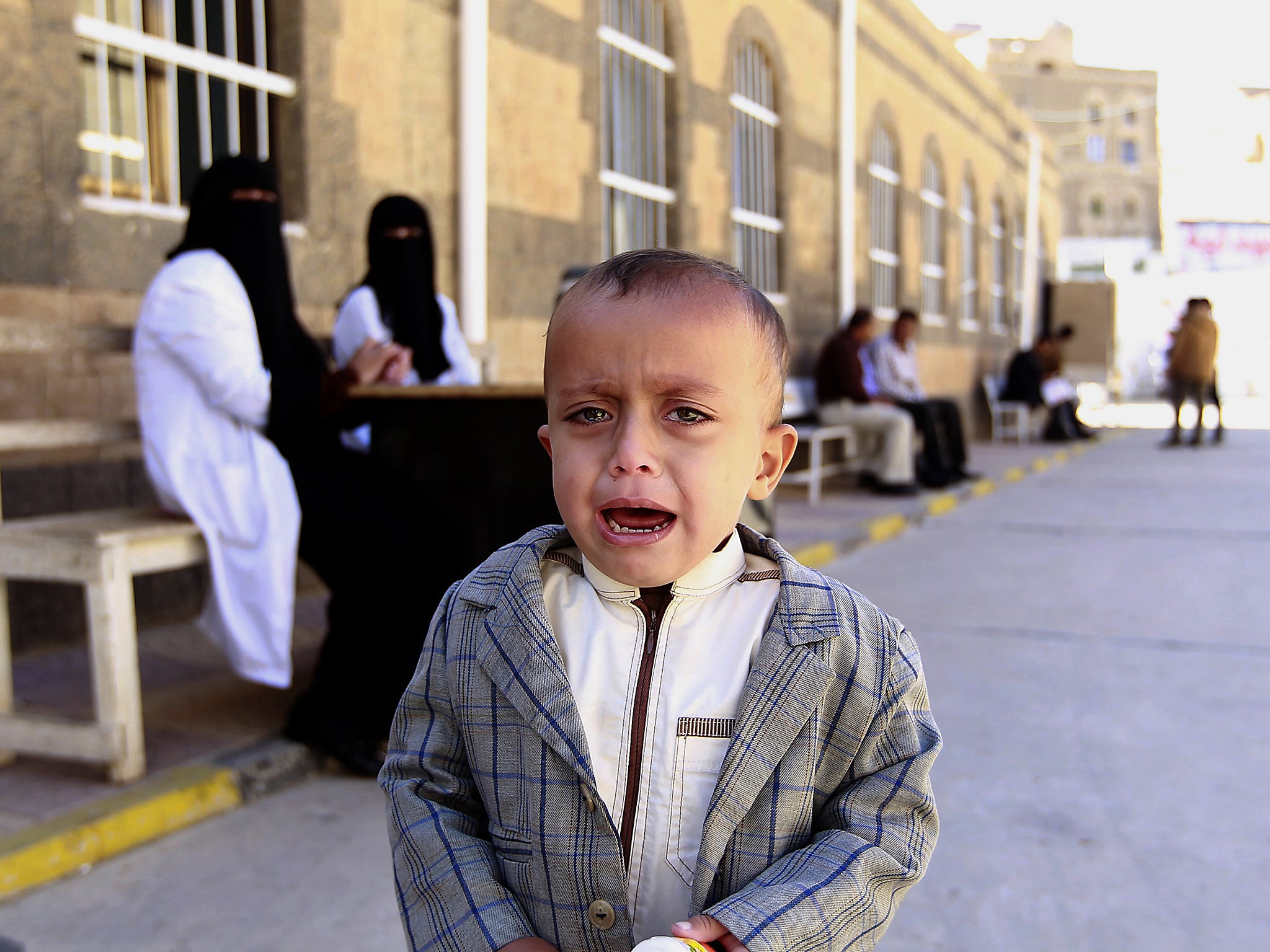 A Yemeni child cries after receiving polio vaccination during an immunisation campaign at a health center in the Yemeni capital Sanaa