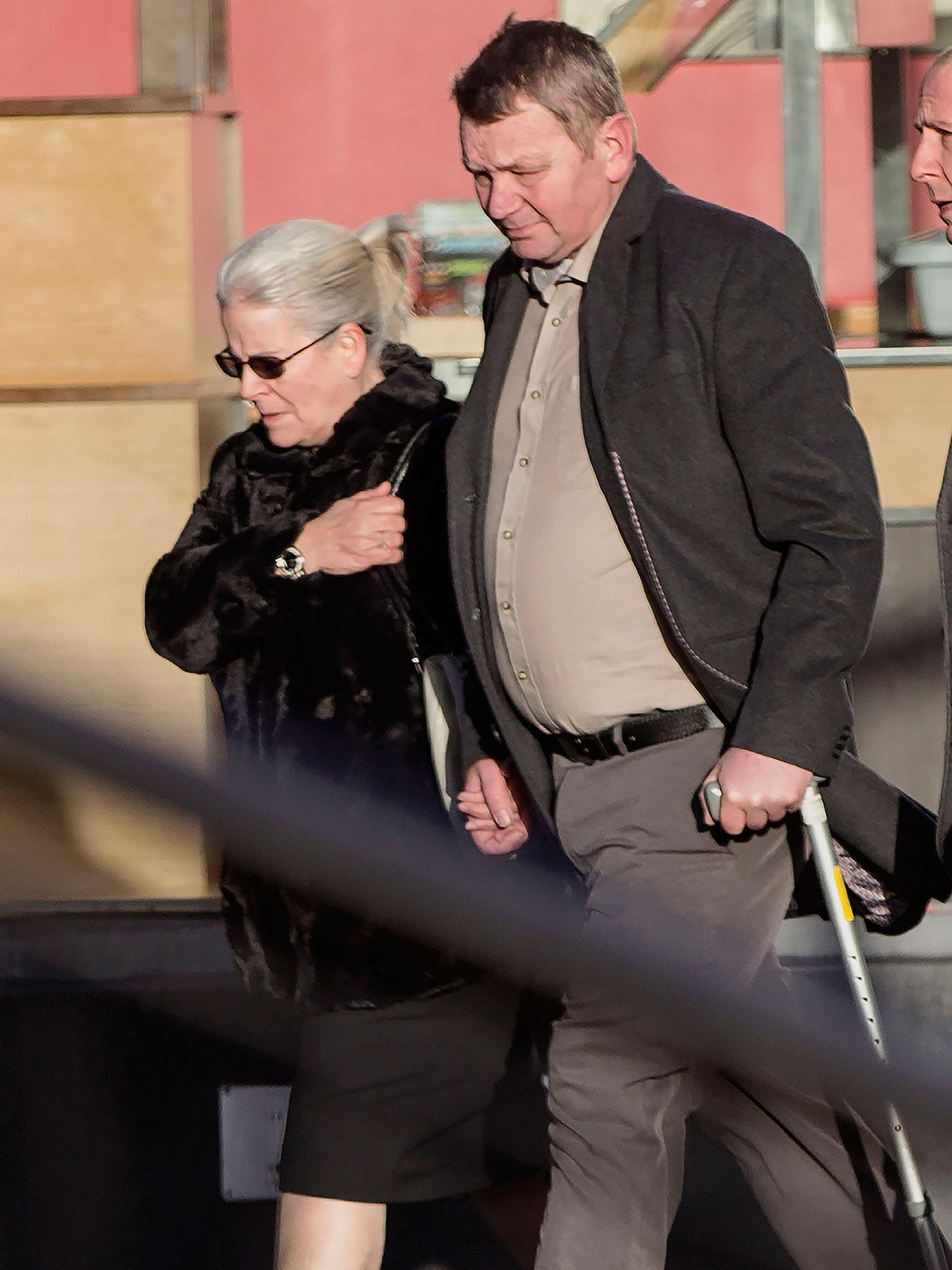 A note reading 'Night, night my darling princess', signed off by Katie's grandparents, who are pictured arriving at court, was left at the scene