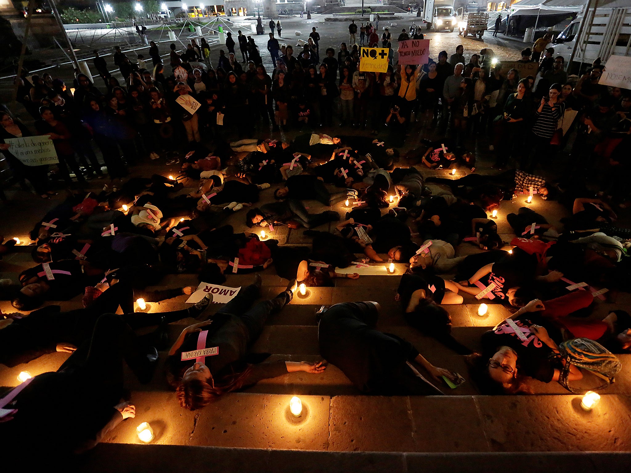 Women lie on the ground during a rally in Mexico against gender violence in November