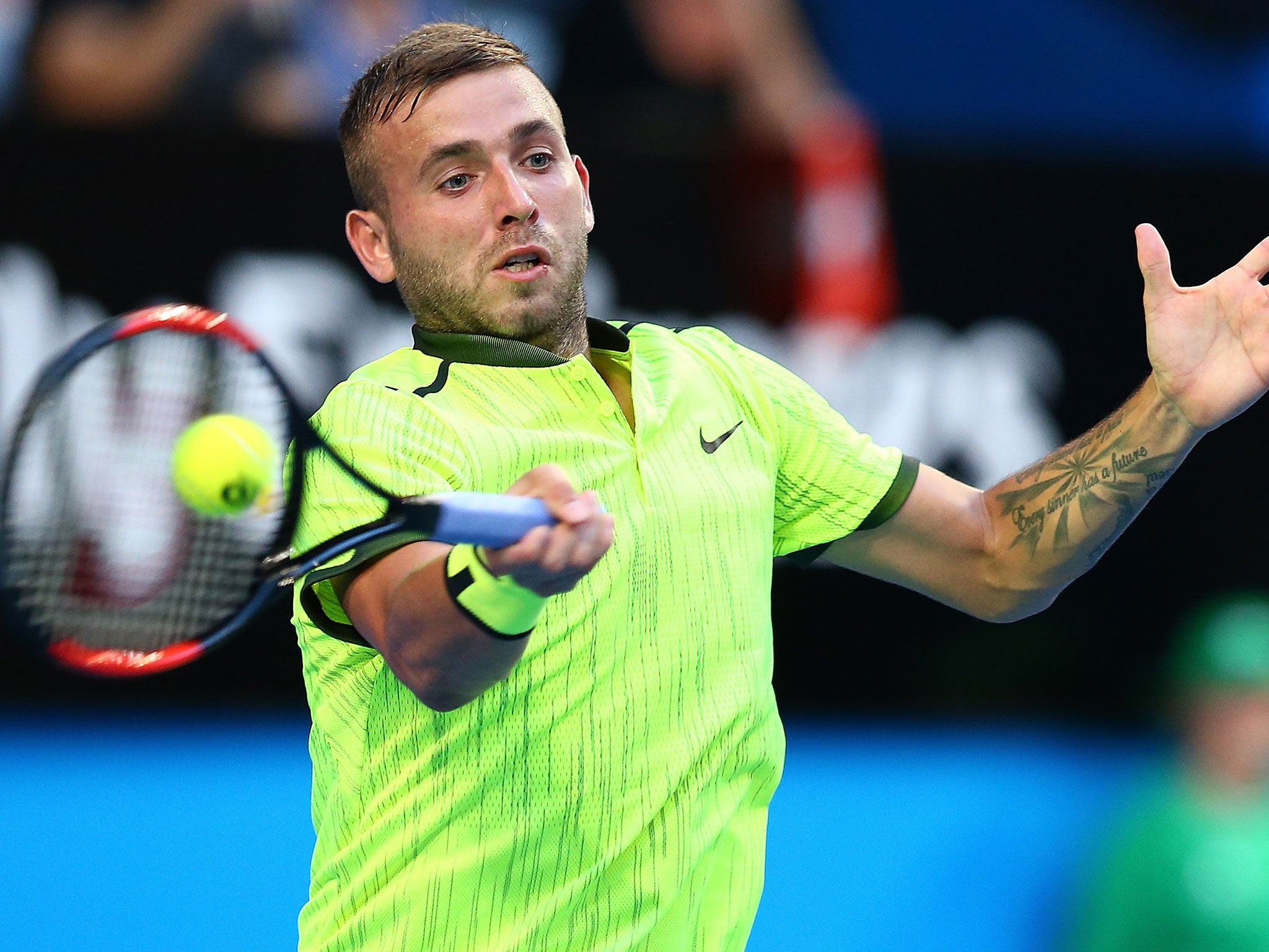 Evans in action against Roger Federer at the Hopman Cup, Perth