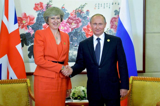 Theresa May and Vladimir Putin at a meeting in 2017