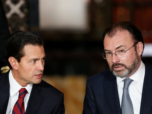 Mexico's President Enrique Pena Nieto chats with Mexico's Foreign Minister Luis Videgaray