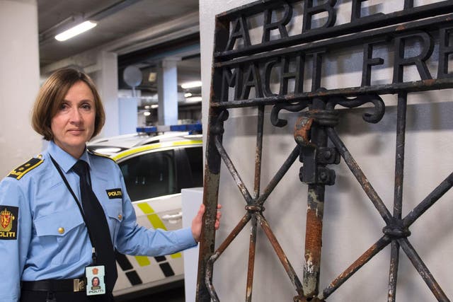 Police Attorney Kari Bjoerkhaug Trones pictured beside the iron gate after it was found on 3 December last year in Bergen