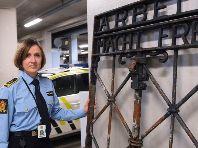 Police Attorney Kari Bjoerkhaug Trones pictured beside the iron gate after it was found on 3 December last year in Bergen