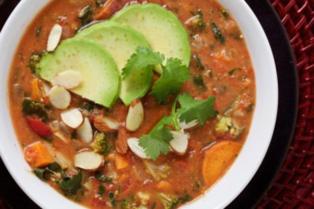 A garnish of avocado and almonds and cilantro completes a perfect wintry bowl