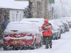 Travel chaos grips Britain as snow, rain and hurricane-force winds hit
