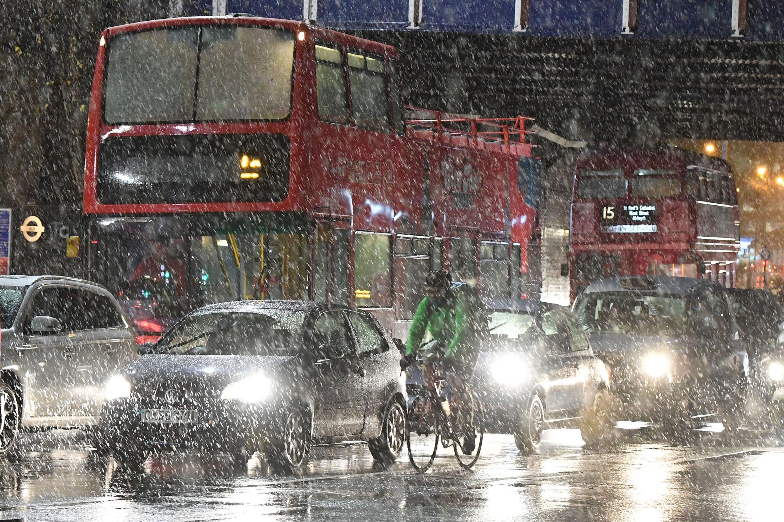Snow began to fall in London shortly before rush hour PA