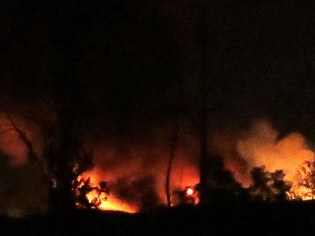 Flames and smoke at the Mezzah military airport on the southwestern outskirts of the capital Damascus