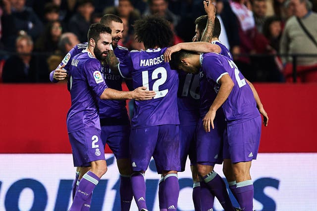 Real Madrid celebrate after Karim Benzema's late equaliser breaks the Spanish unbeaten record
