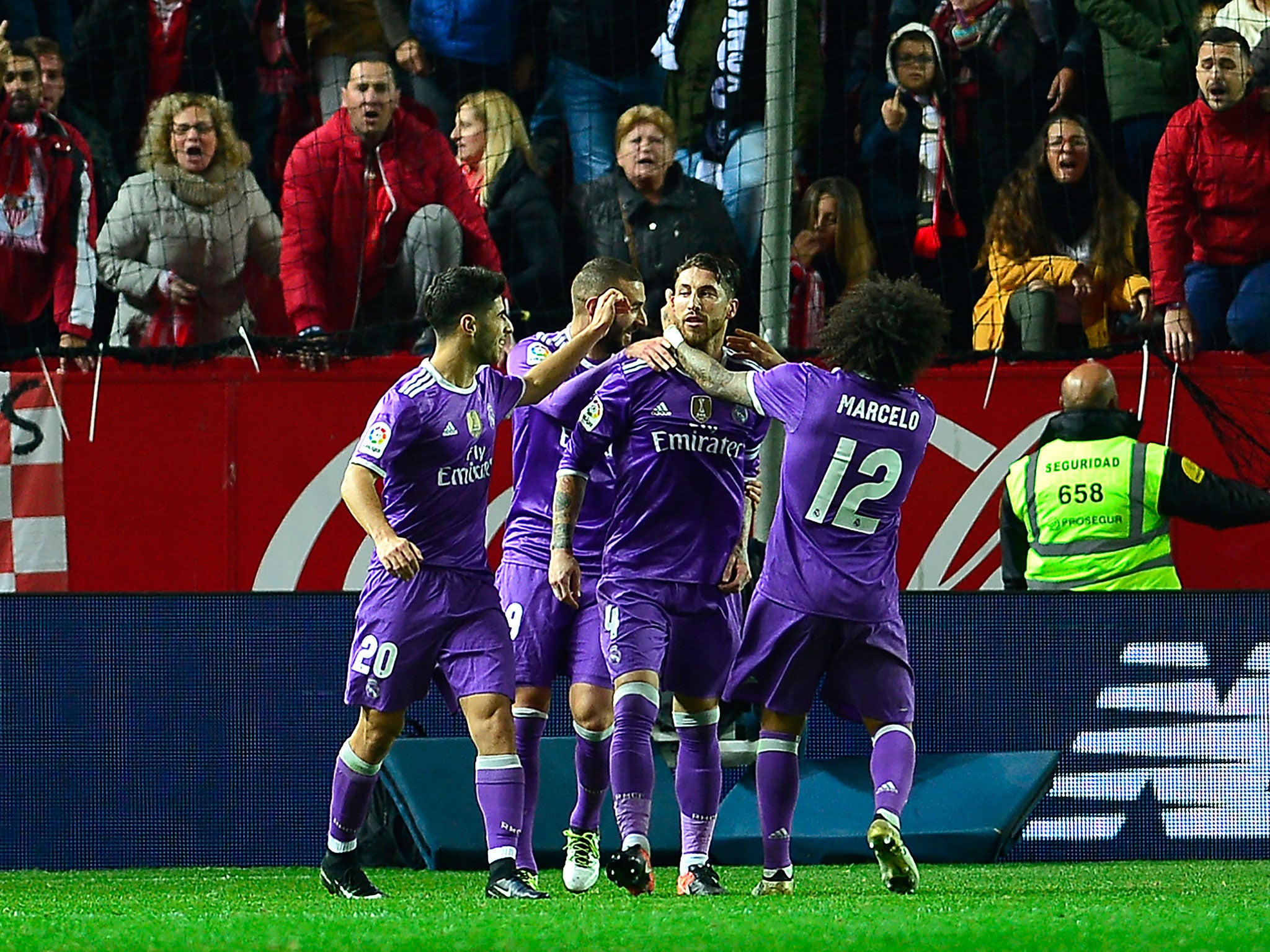 Sergio Ramos celebrates with his teammates after scoring