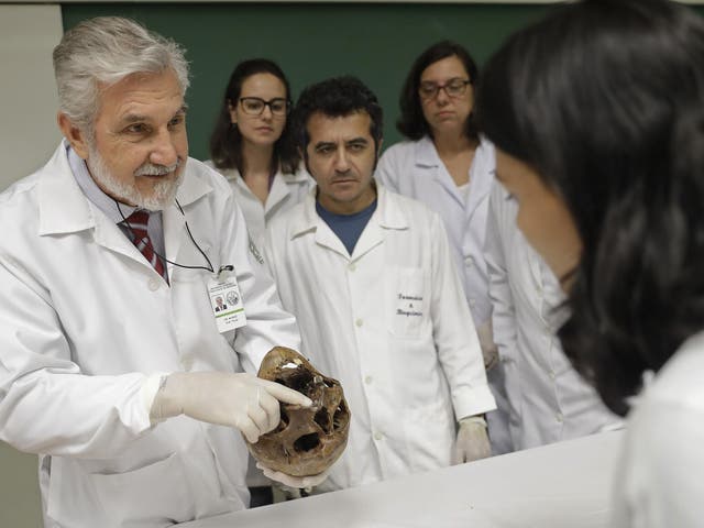 Daniel Munoz shows the skull of Nazi war criminal Josef Mengele, at the school of medicine of Sao Paulo University in Sao Paulo, Brazil.
