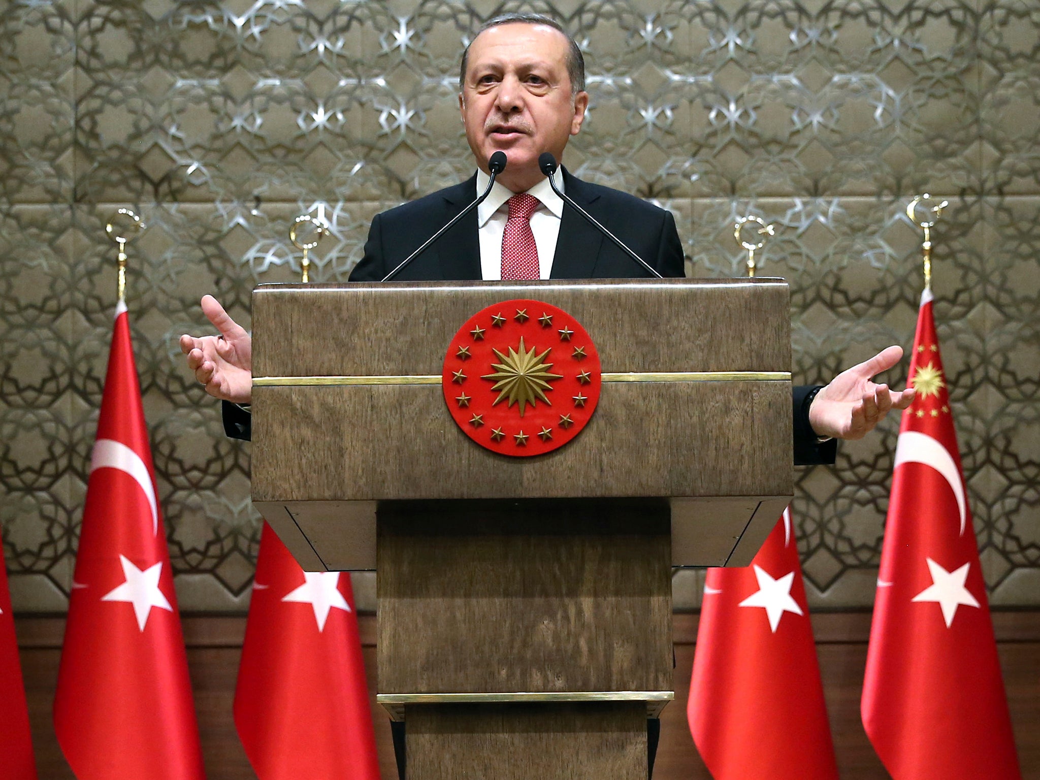 Turkey's President Recep Tayyip Erdogan addresses village administrators in Ankara, Turkey