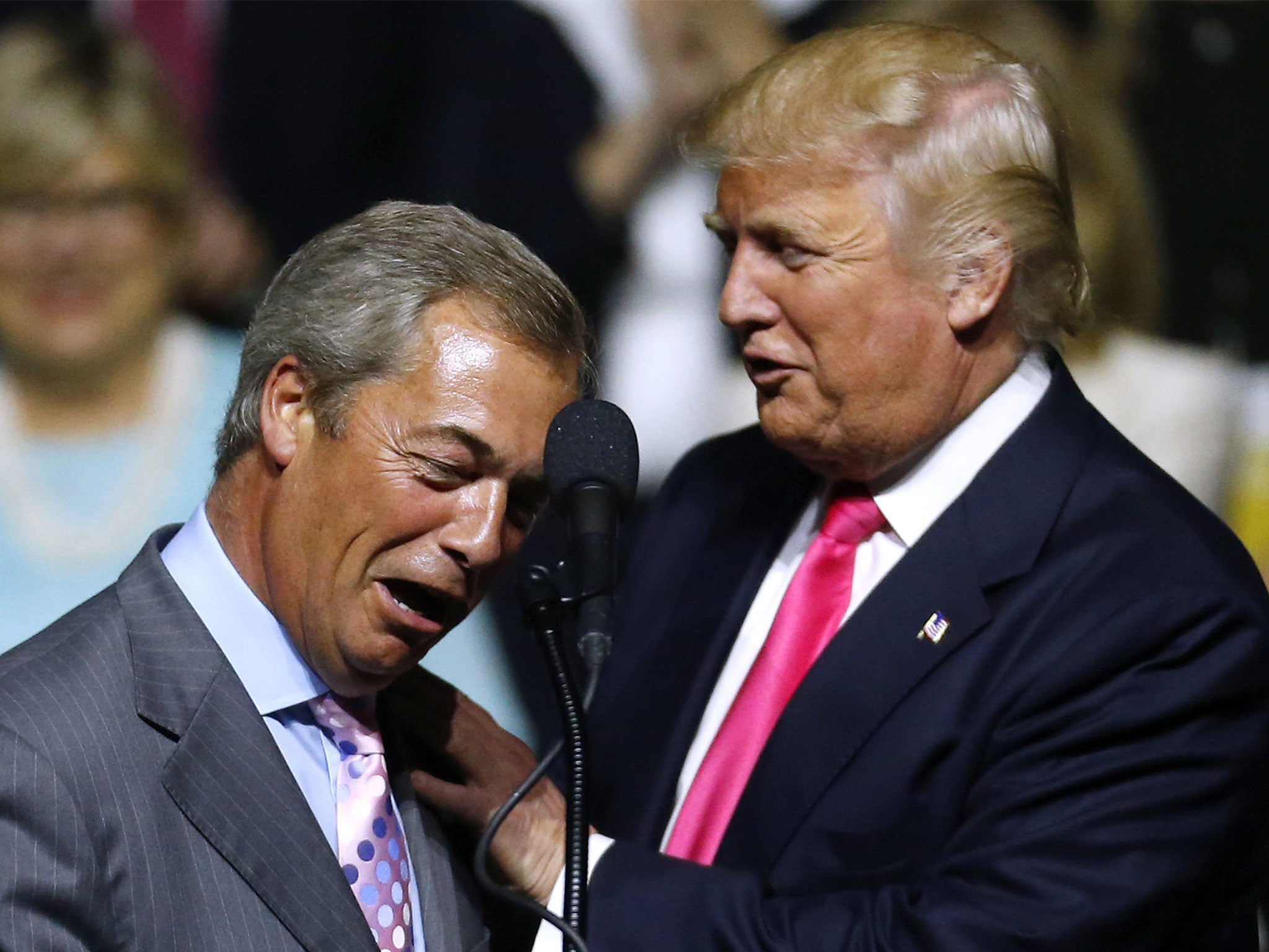 Donald Trump, right, greeting former Ukip leader Nigel Farage during a campaign rally in August 2016