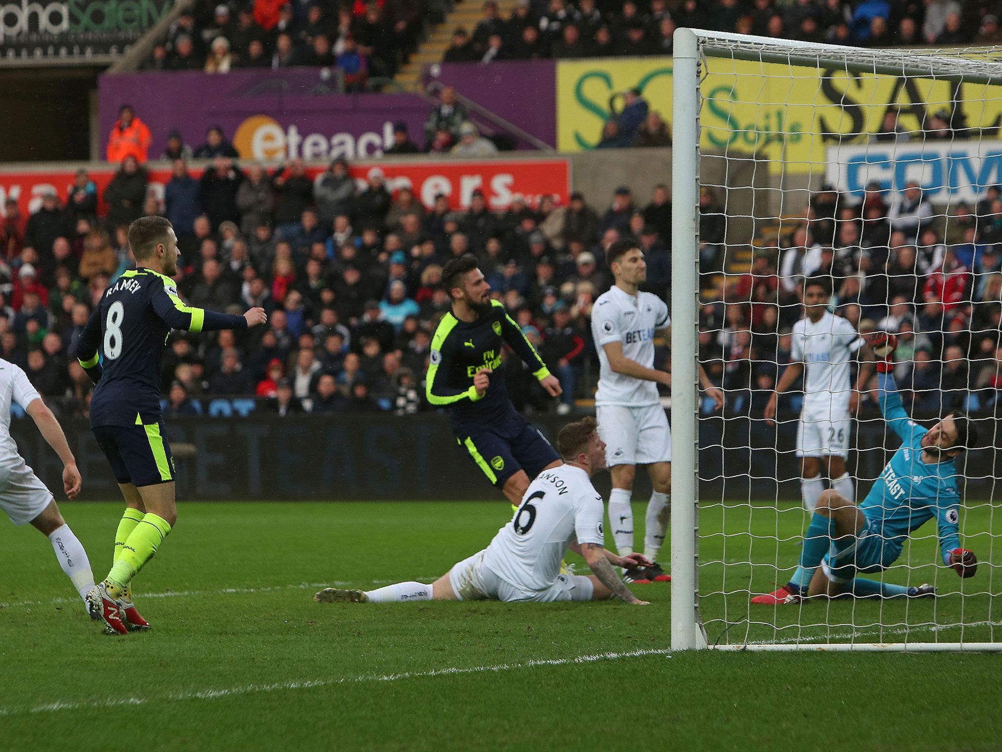 Olivier Giroud scores Arsenal's first goal against Swansea and sets them on their way