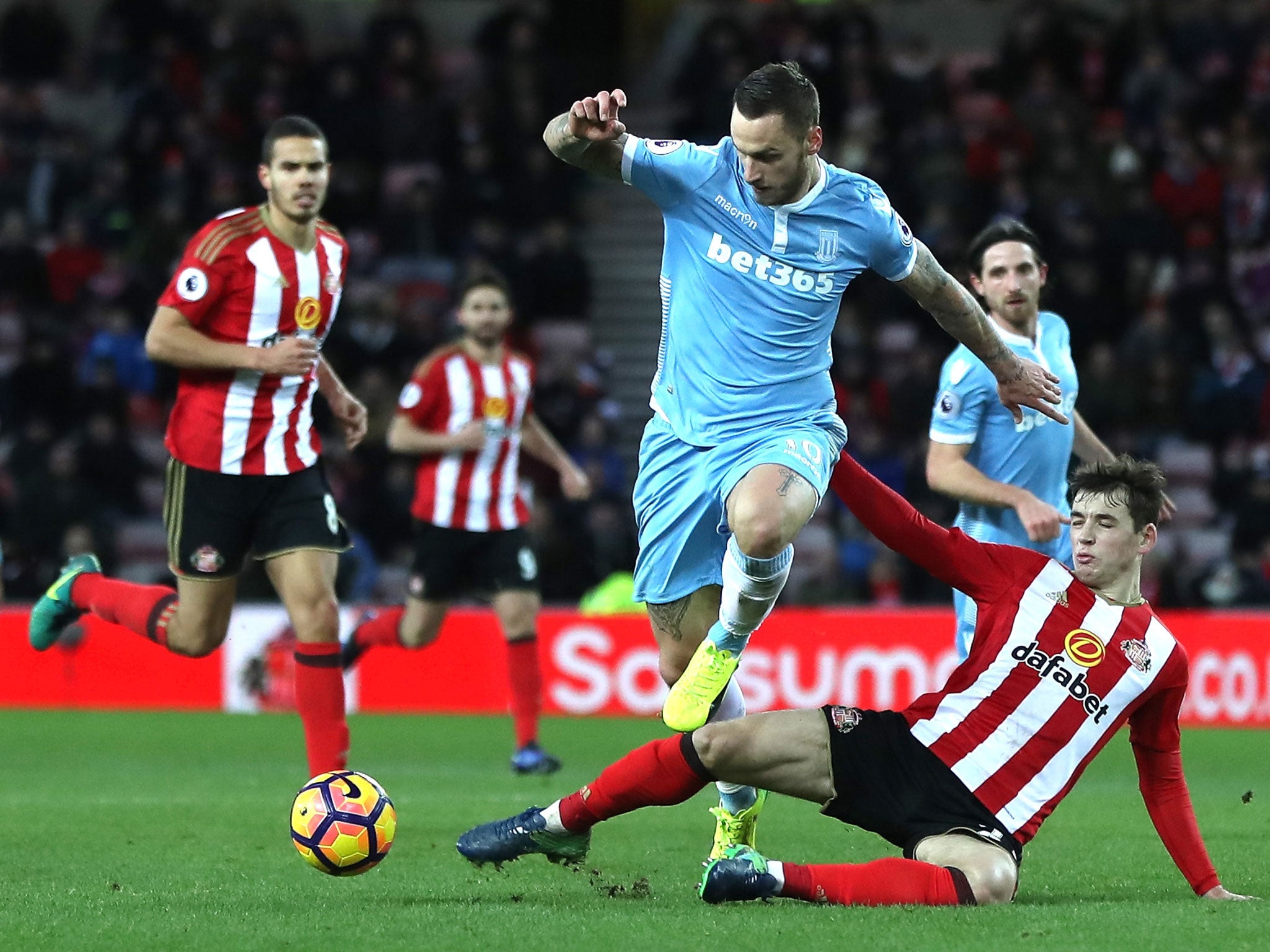 Donald Love puts in a challenge on Marko Arnautovic