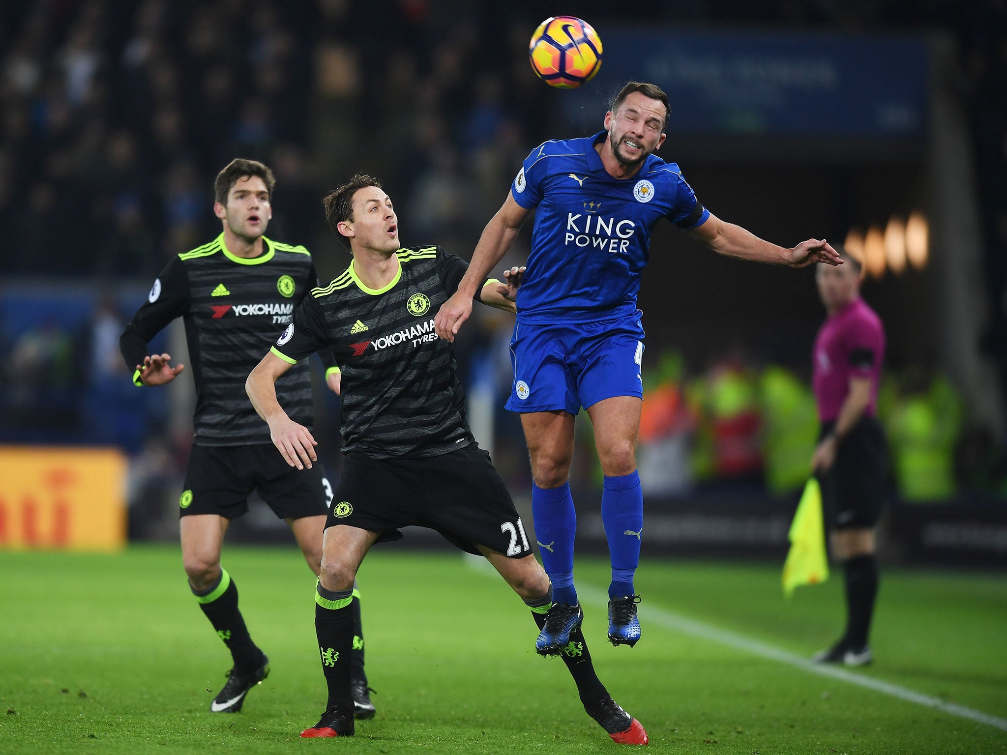 Danny Drinkwater heads the ball under pressure