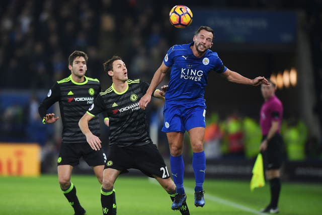Danny Drinkwater heads the ball under pressure