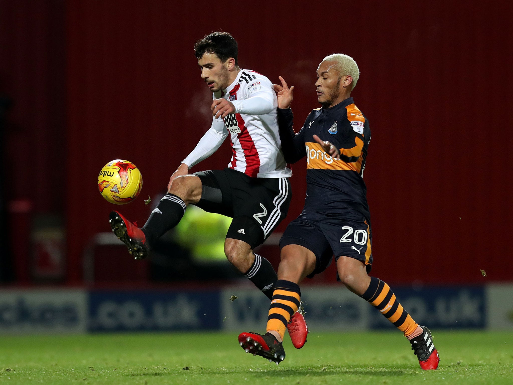 Brentford's Maxime Colin (left) and Newcastle United's Yoan Gouffran battle for the ball