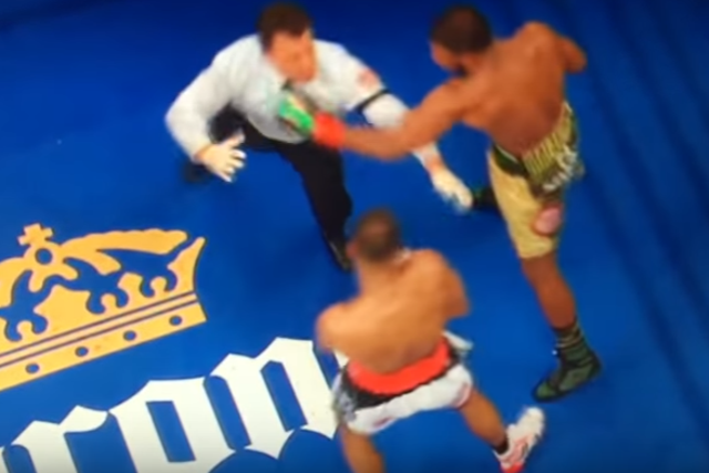 Referee Arthur Mercante Jr takes a left hook straight to the face