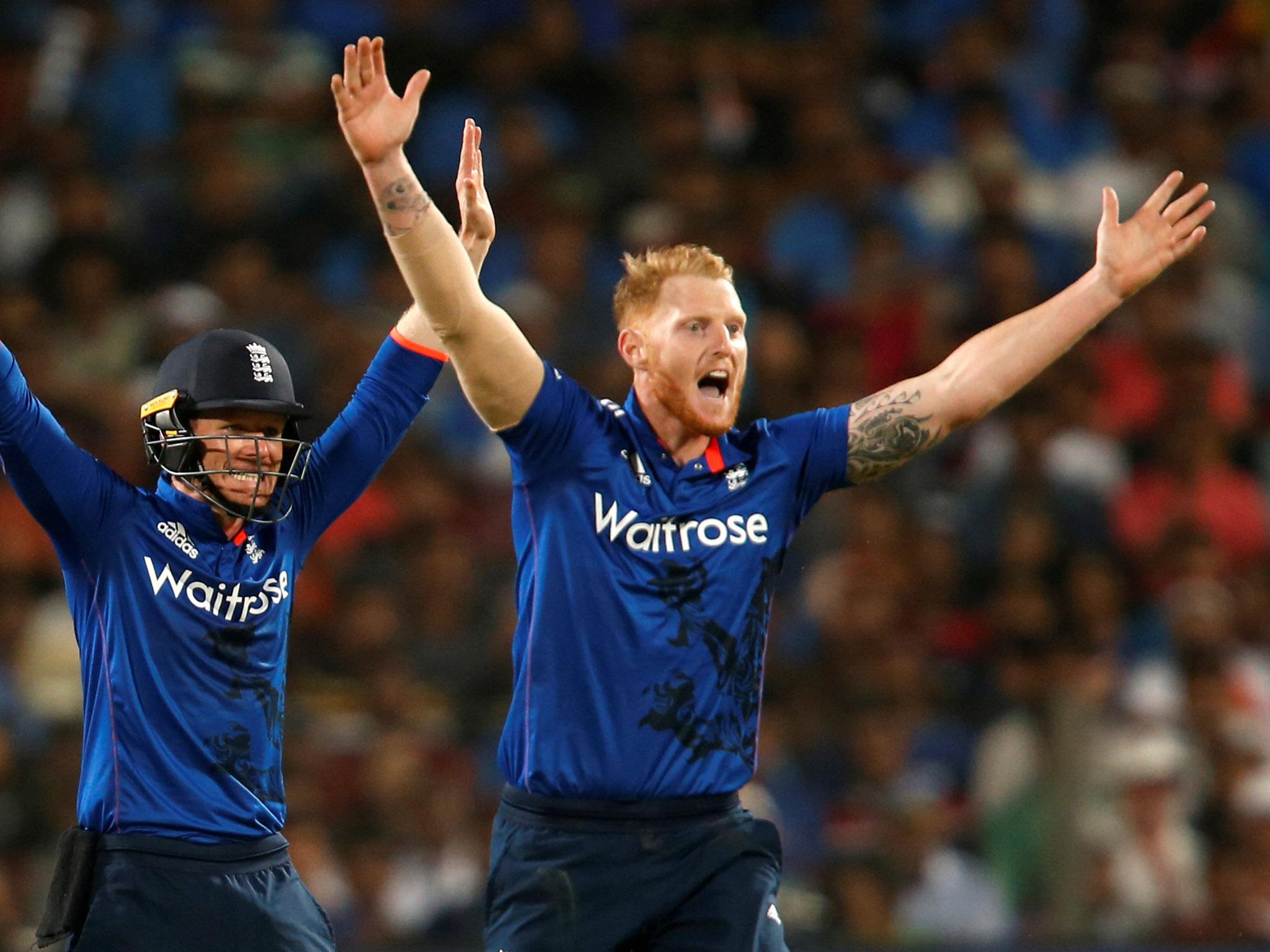 England's captain Eoin Morgan (L) and his teammate Ben Stokes appeal successfully to dismiss India's Yuvraj Singh