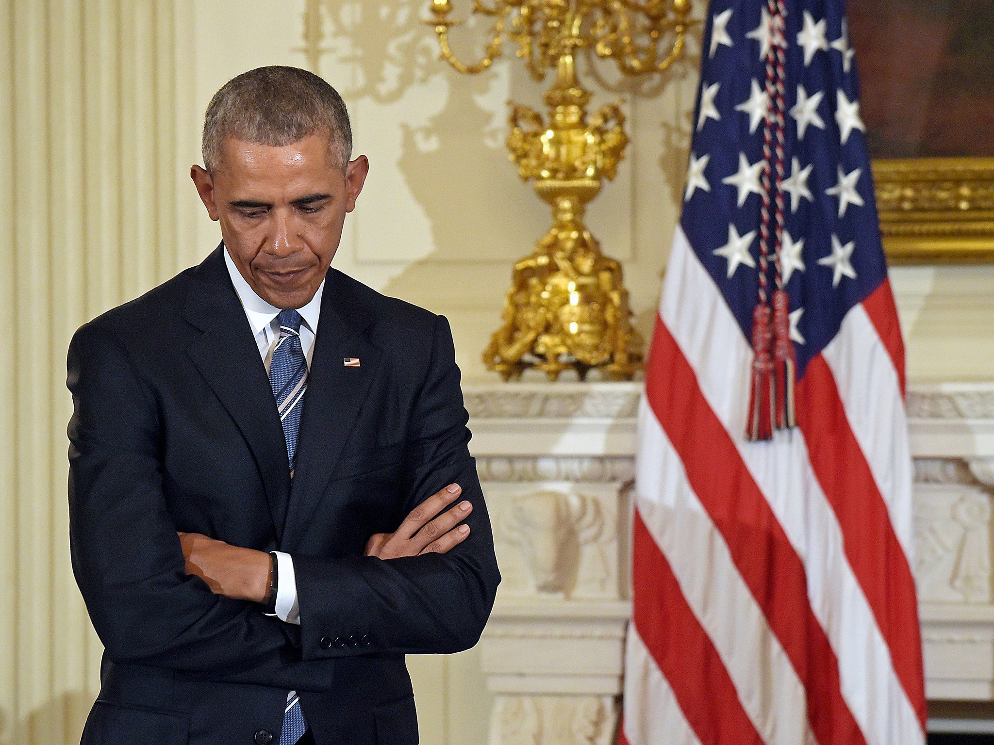 President Barack Obama in a moment of reflection at a ceremony in the State Dining Room of the White House in Washington DC