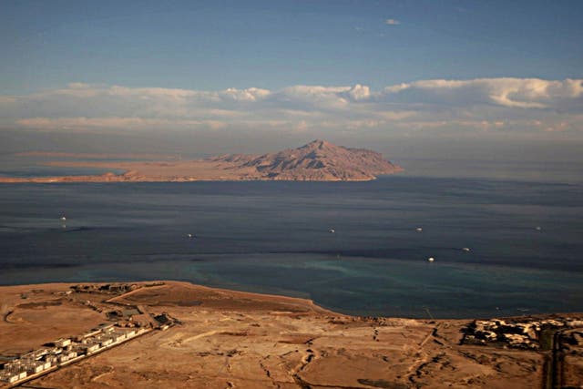 The Red Sea's Tiran (foreground) and the Sanafir (background) islands in the Strait of Tiran between Egypt's Sinai Peninsula and Saudi Arabia, seen from a plane