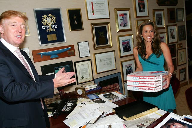 Mr Trump alongside Apprentice contestant Stephanie Myers in his office on 1 April, 2005