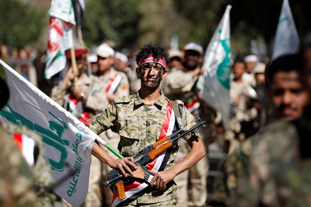 Newly recruited Houthi fighters parade before heading to the frontline to fight against government forces in Sanaa