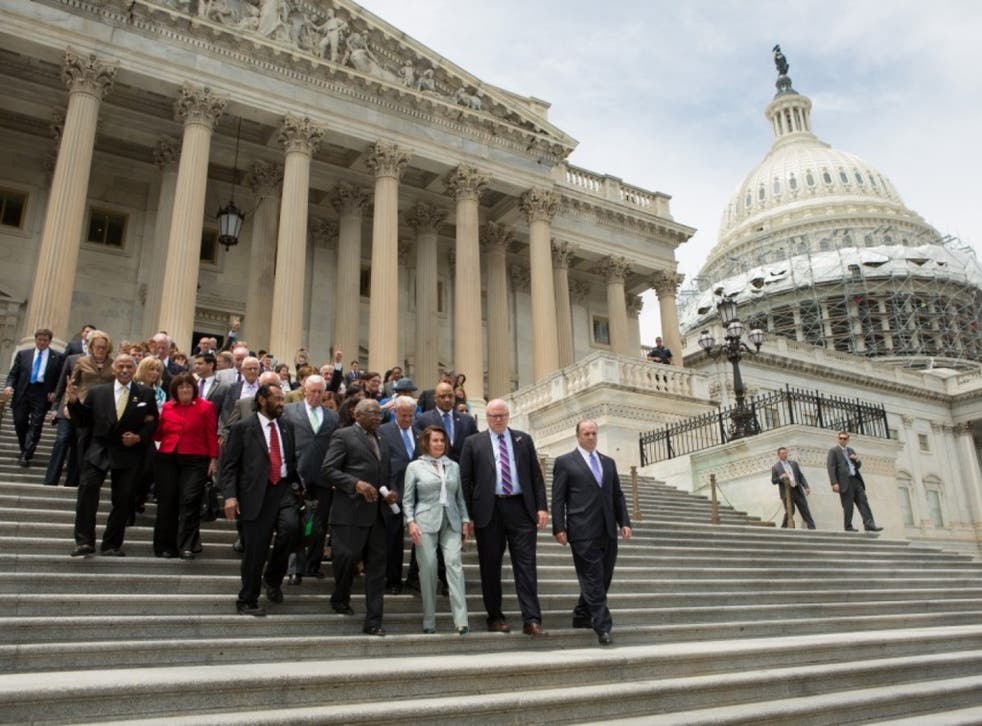 House members walk down the East Front of the US Capitol