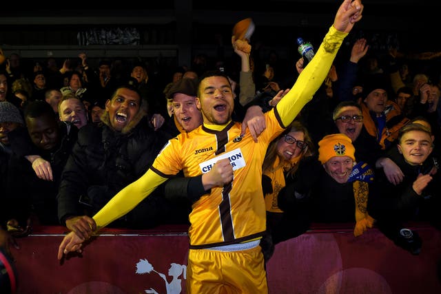 Maxime Biamou, scorer of Sutton's second goal, could not help but celebrate with the fans at the final whistle