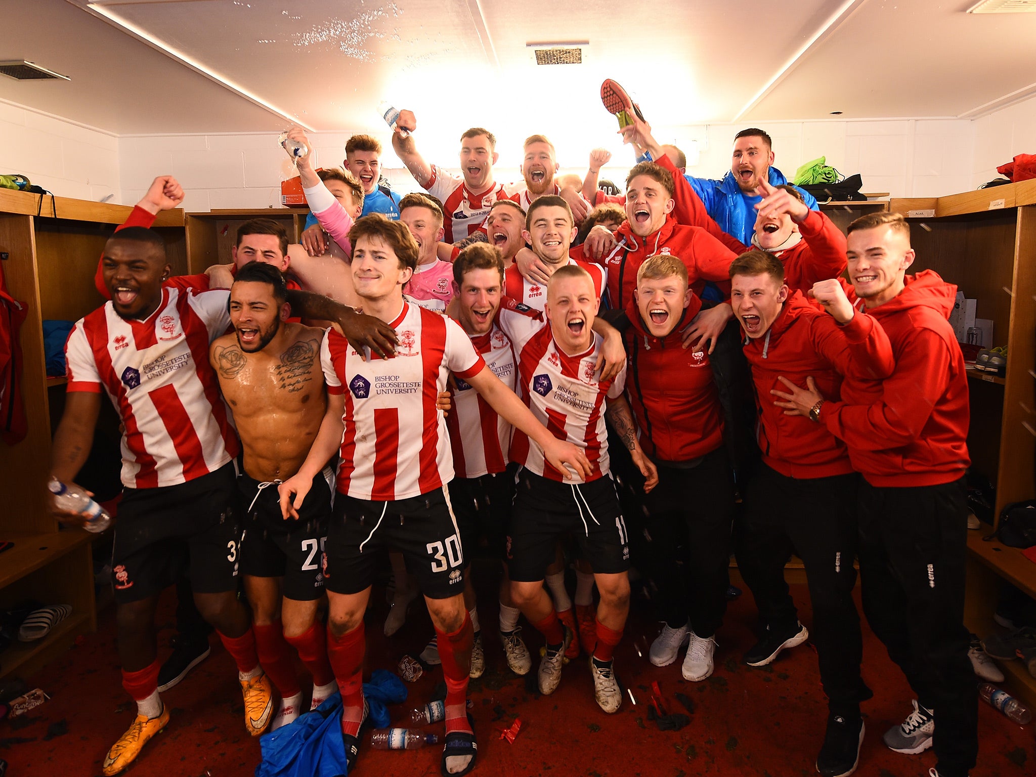 Lincoln's player celebrate their famous win over their Championship opponents