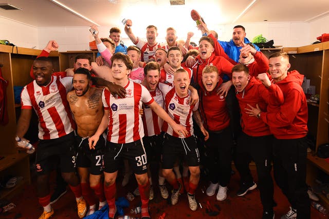 Lincoln's player celebrate their famous win over their Championship opponents