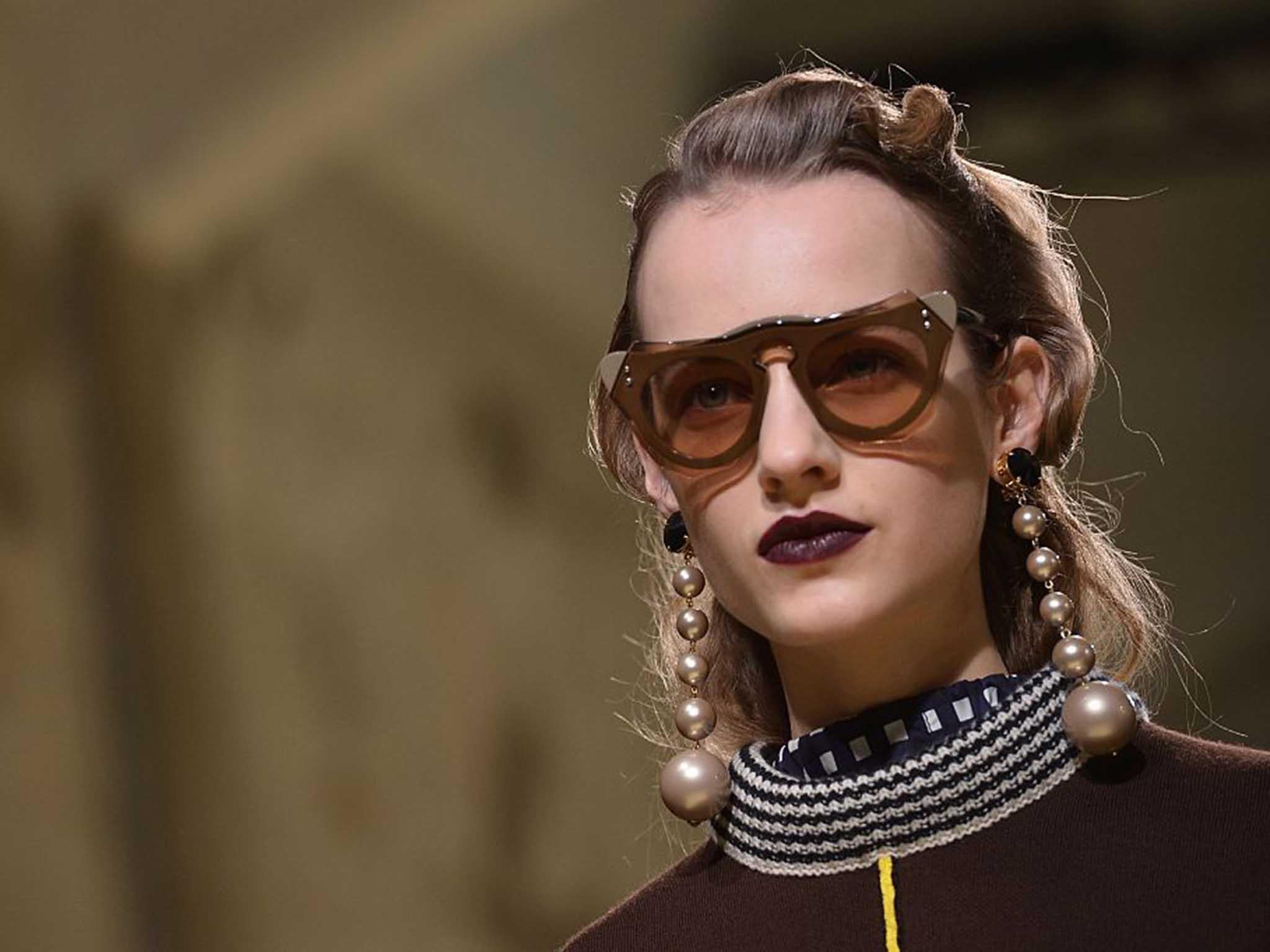 Marni complimented retro quaffed waves with gobstopper pearl earrings