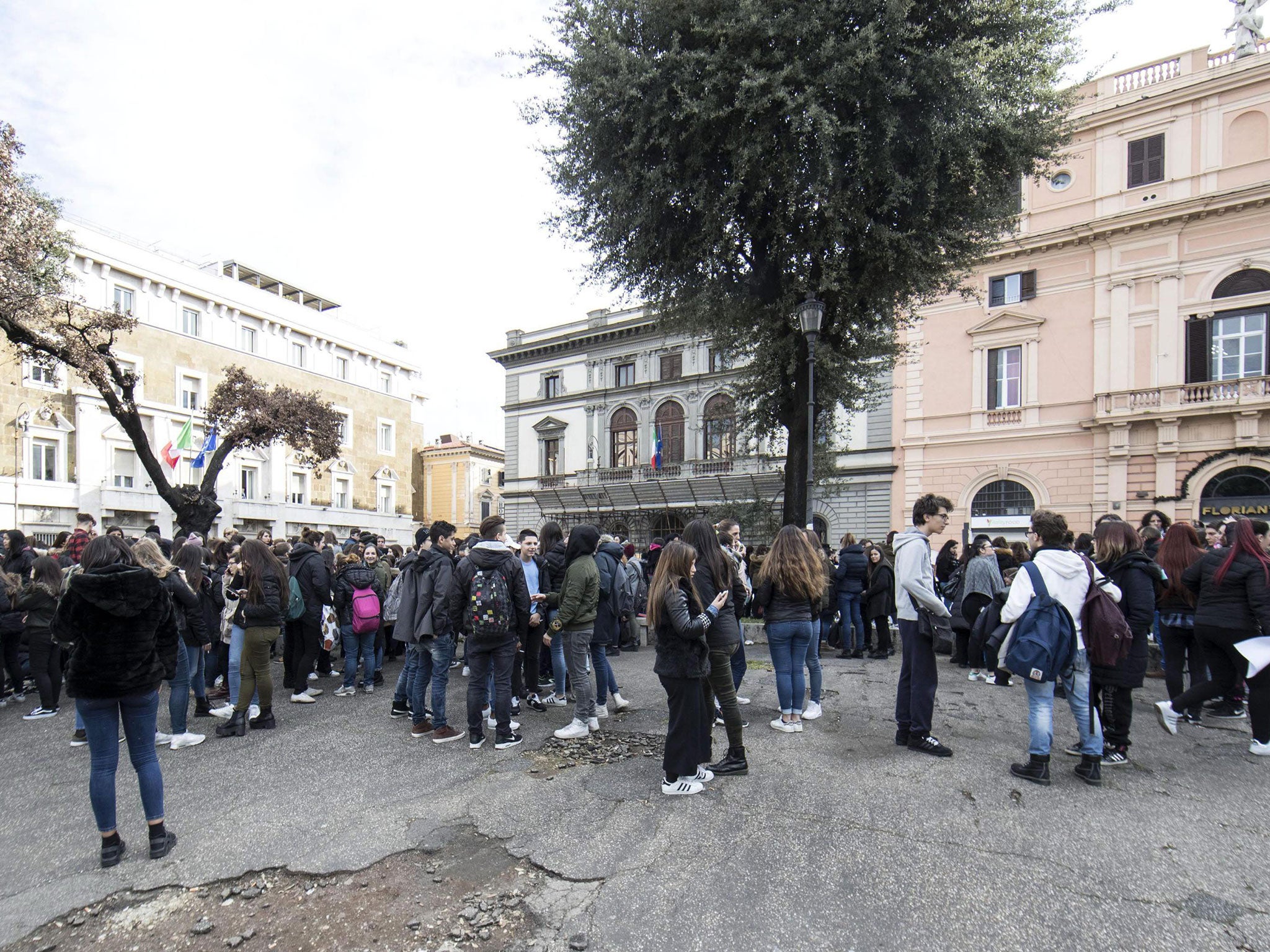 Students and teachers after being evacuated from the Machiavelli school after a series of earthquakes were felt in Rome