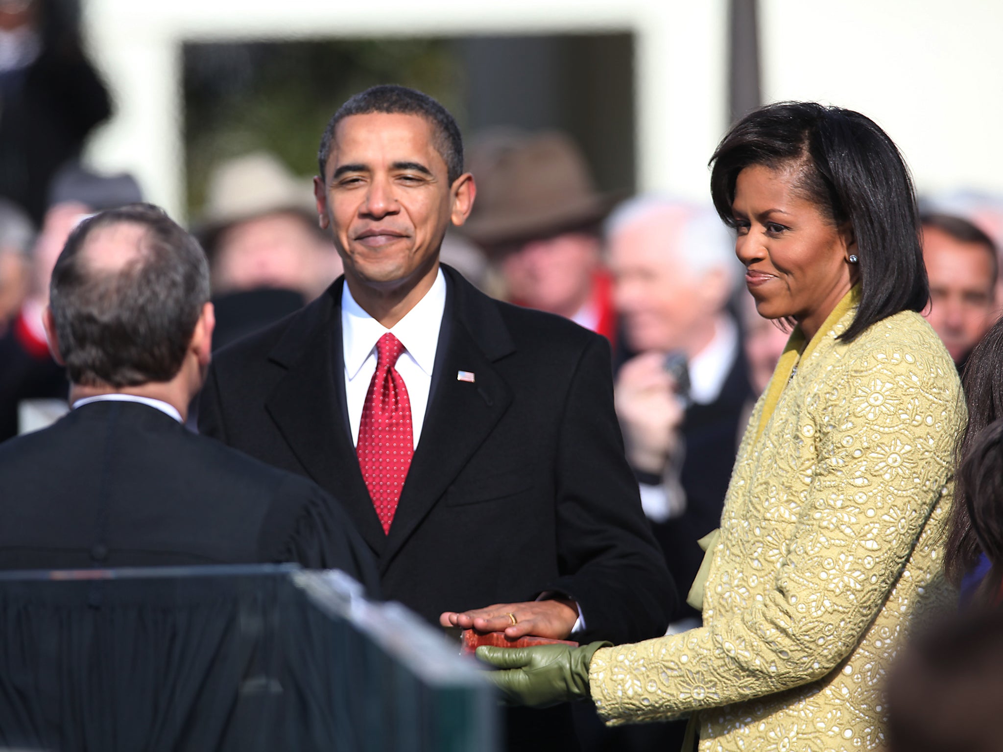 Barack Obama rests his hand on the bible that President Lincoln used for his swear-in