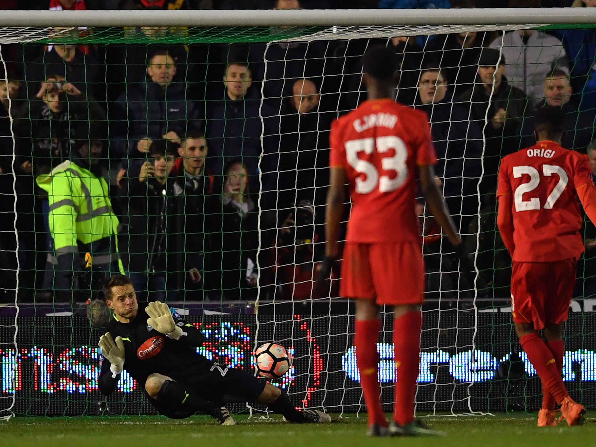 &#13;
Divock Origi's late penalty was stopped low by Luke McCormick &#13;