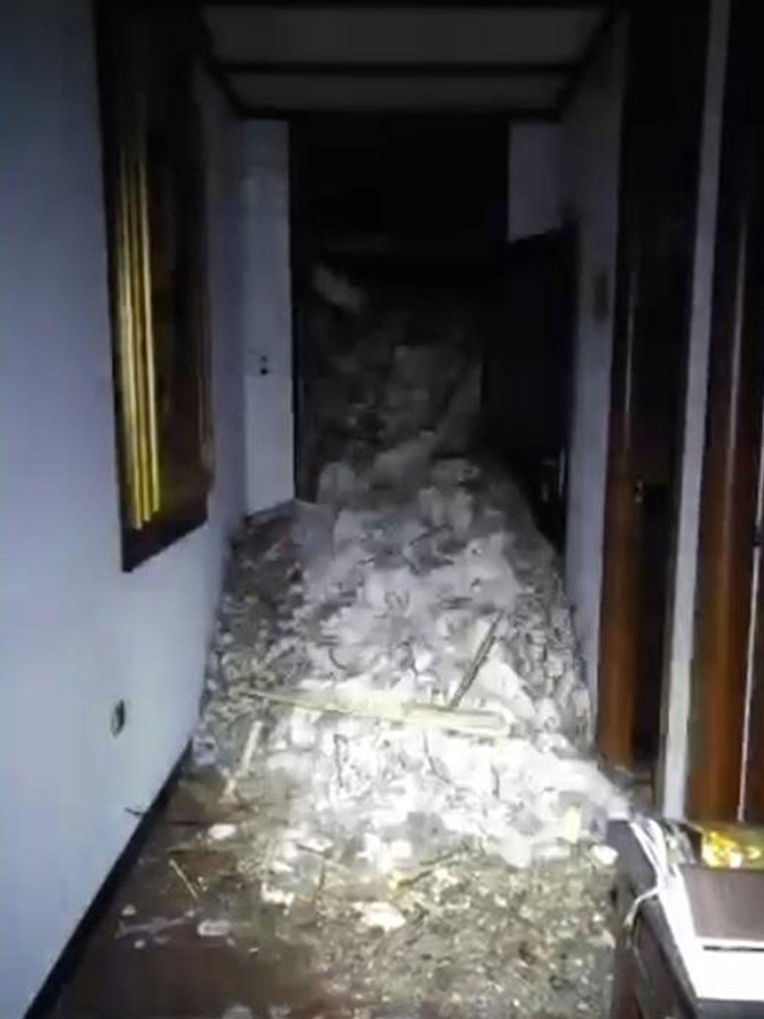 Video shows show piles of snow and rubble inside the hotel