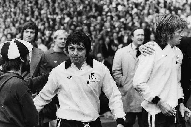 Jimmy Conway (left) and John Mitchell, two dejected Fulham players leave the pitch at Wembley after being beaten 2-0 in the FA Cup Final against West Ham United