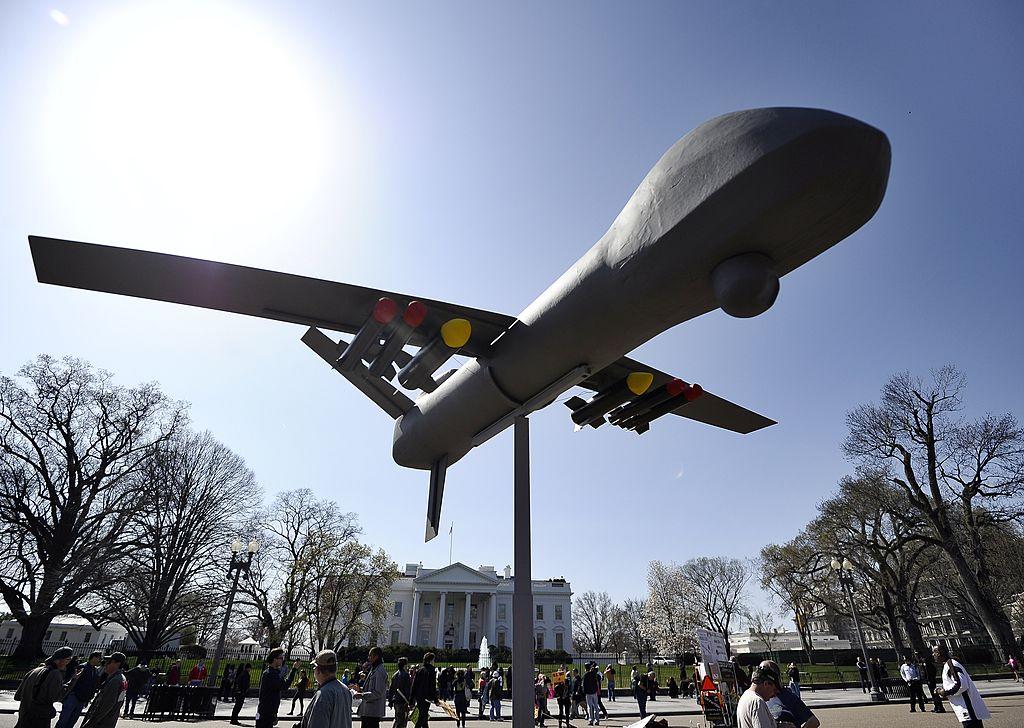 Anti-war protestors and a drone model outside the White House in Washington DC in March 2011 