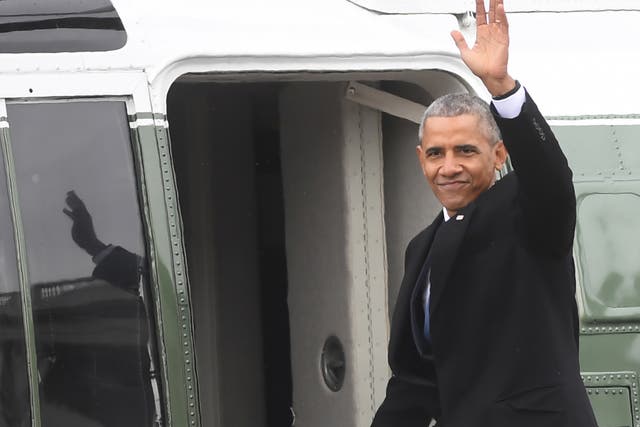 Barack Obama climbs aboard Marine One en route to Joint Base Andrews