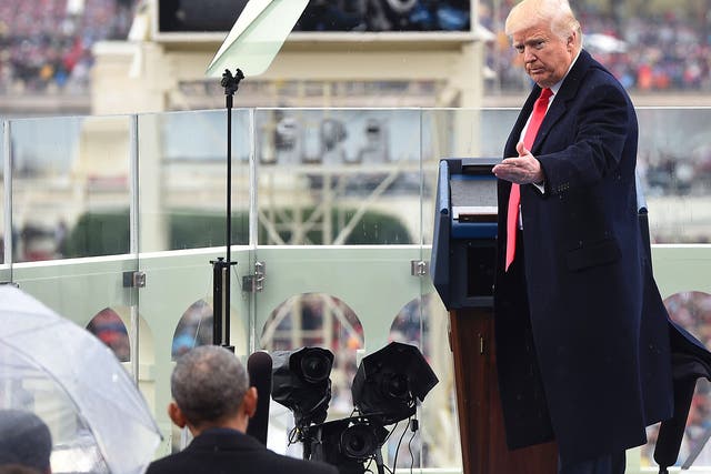 US President Donald Trump thanks former US President Barack Obama during the Presidential Inauguration at the US Capitol in Washington DC