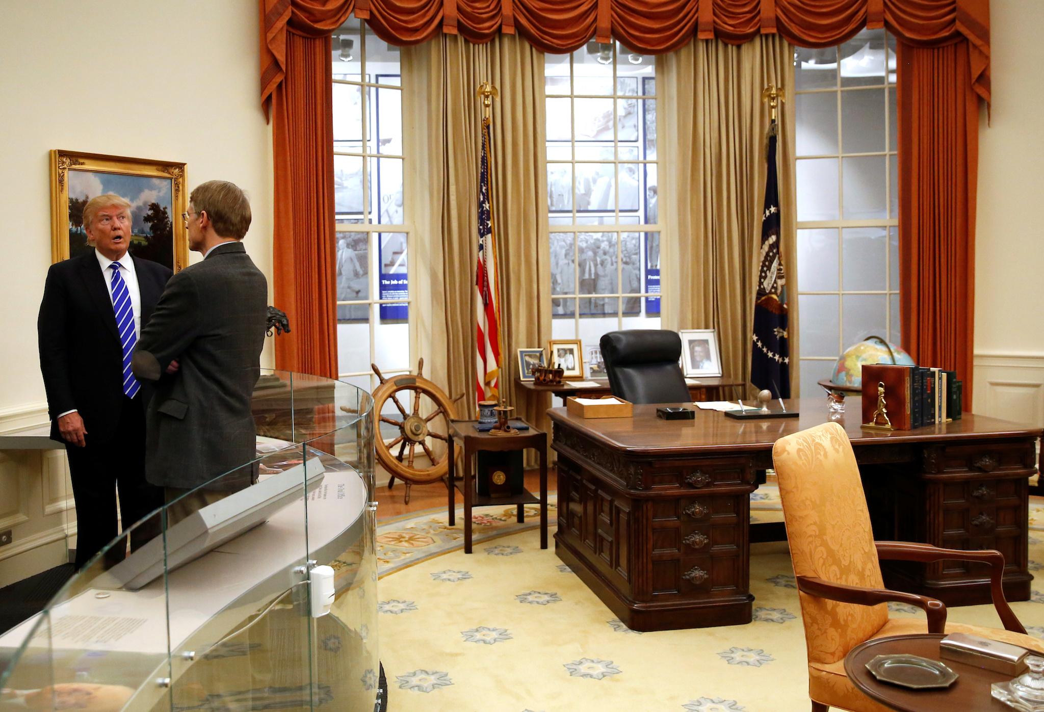 Republican presidential nominee Donald Trump views a replica of the Oval Office on a tour of the Gerald Ford Presidential Museum in Grand Rapids, Michigan, U.S. September 30, 2016