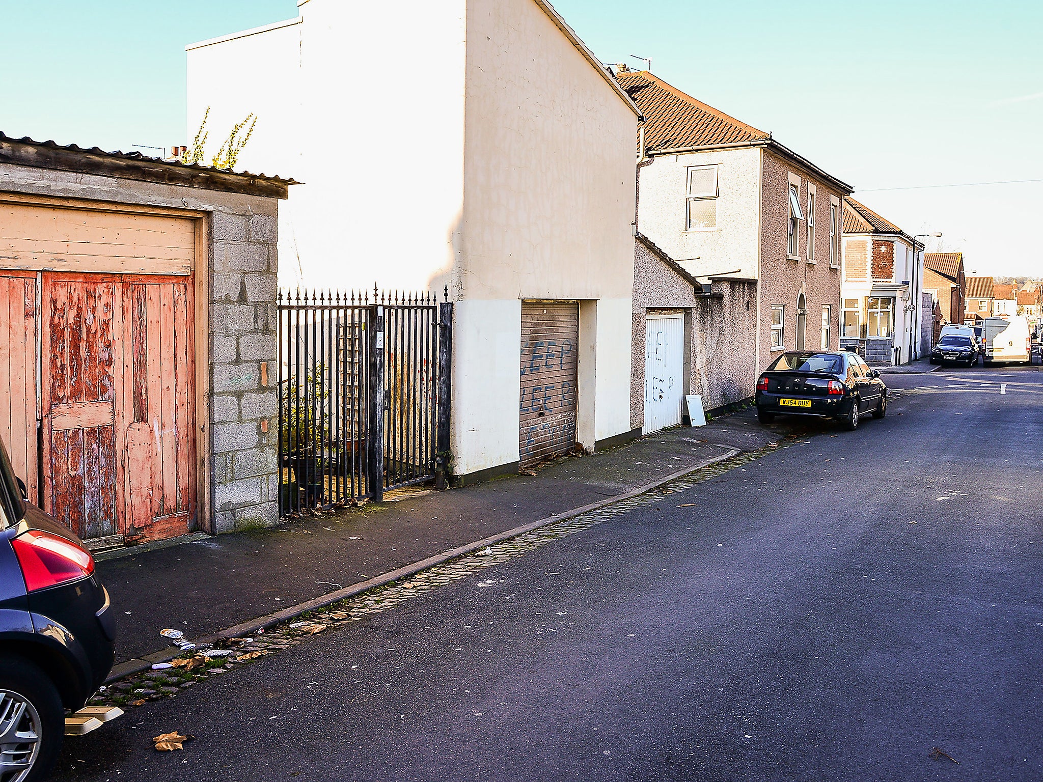 The gated entrance and garages on King Street, Easton, Bristol, where Judah Adunbi was allegedly hit with a stun gun by police (PA)