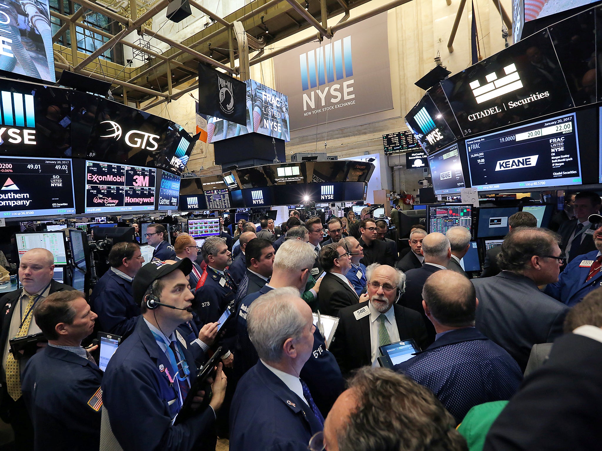 Traders gather on the floor of the New York Stock Exchange (NYSE) in Manhattan, New York City
