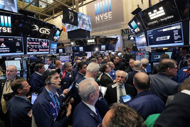 Traders gather on the floor of the New York Stock Exchange (NYSE) in Manhattan, New York City