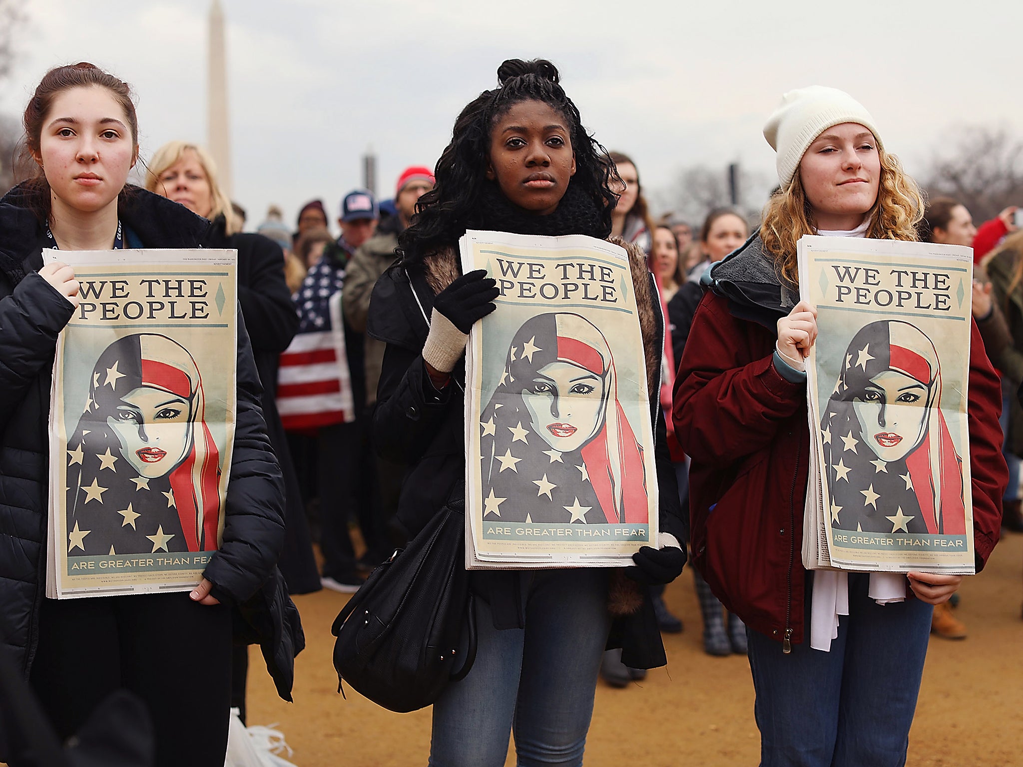 Protesters on the national mall watch the inauguration of US President Donald Trump