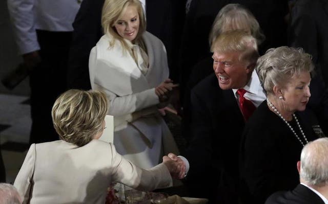 Donald Trump shakes hands with Hillary Clinton during the Inaugural luncheon at the National Statuary Hall in Washington on January 20, 2017.