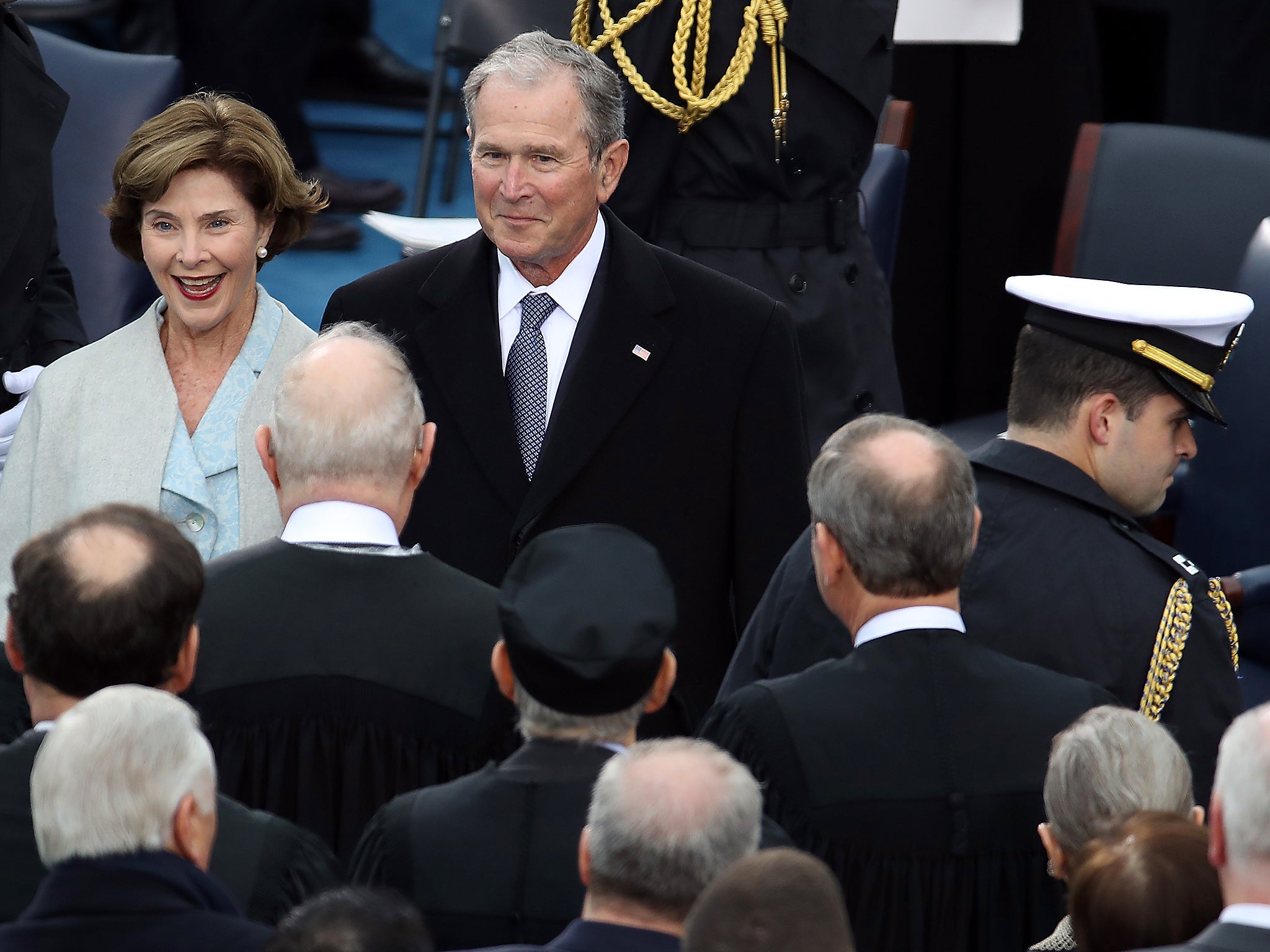 Former president George W. Bush and former first lady Laura Bush at the inauguration ceremony of Donald Trump in 2017. He has been poking fun at the advanced ages of both Joe Biden and Donald Trump in private speeches, according to a report