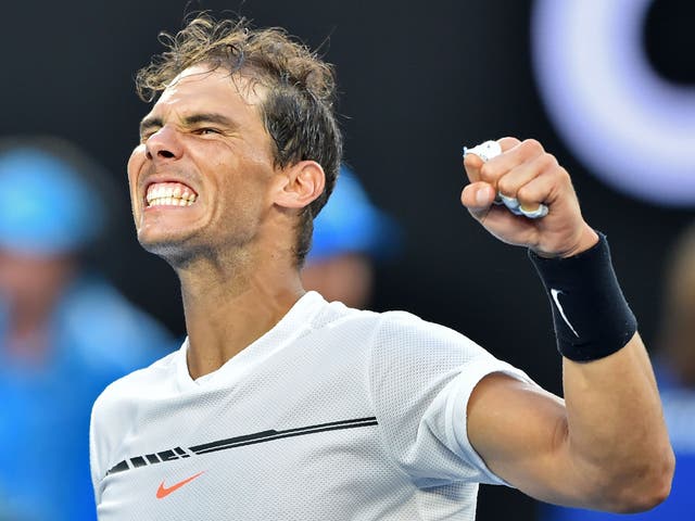Rafael Nadal punches the air in delight after beating Alexander Zverev in a five-set thriller