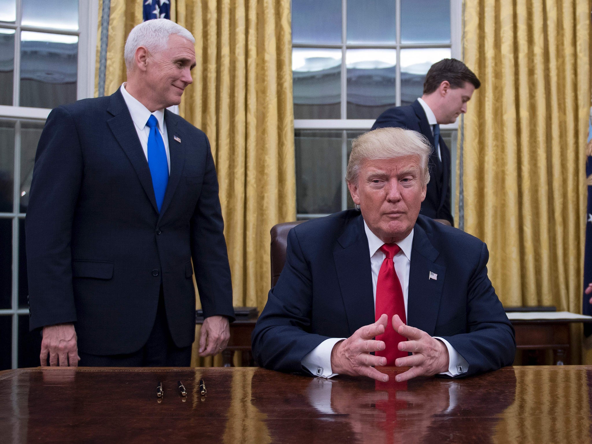 Trump sits in the Oval Office for the first time prior to signing approvals for Gens Mattis and Kelly